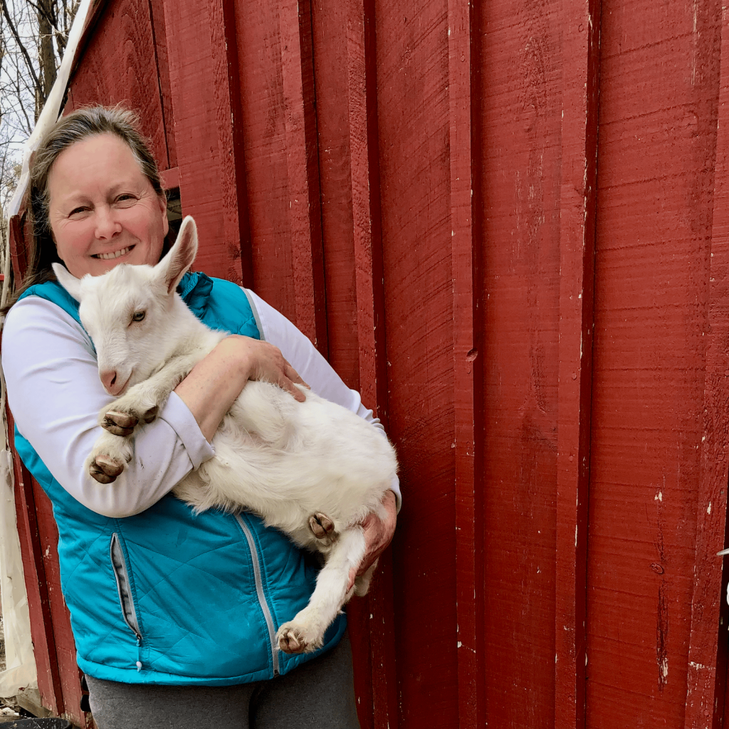 Krista holding a baby goat