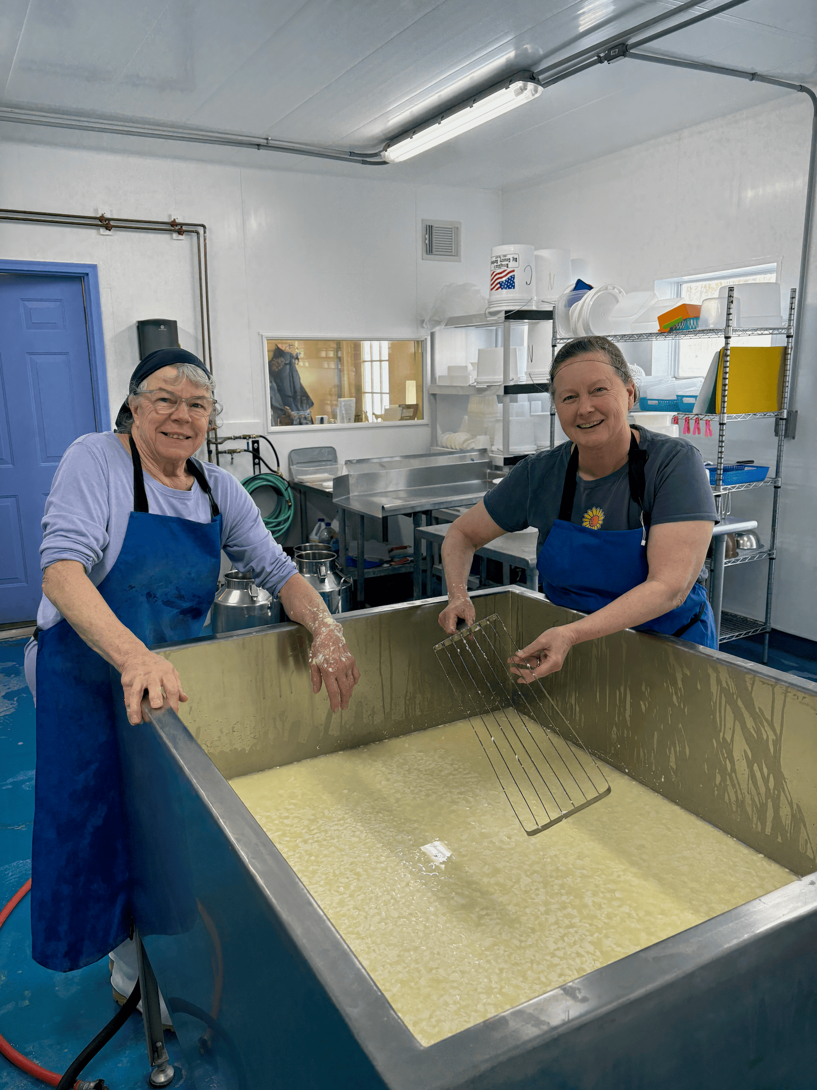 two women making cheese