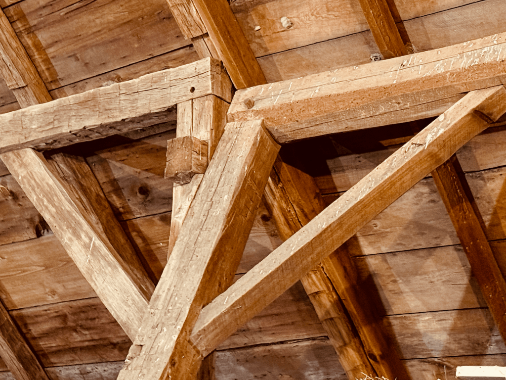 Photo of the connection point of the original gunstock barn frame and a=later addition