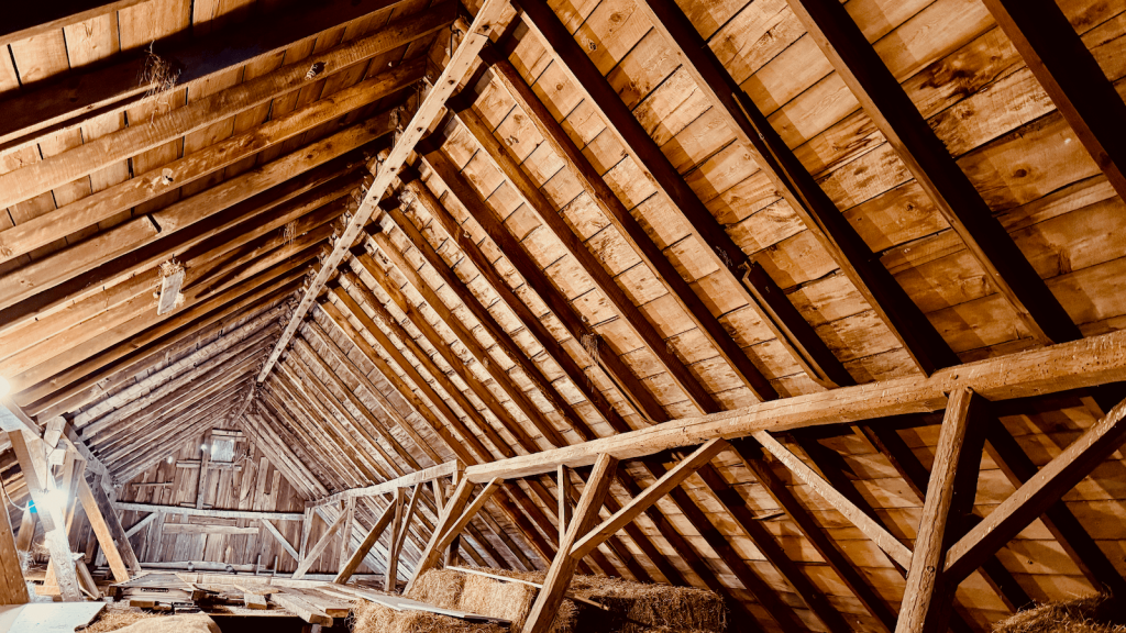Photo of barn structure showing both original barn and addition framing structure